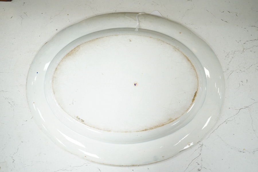 A 19th century Spode blue and white oval dish, with classical central scene and unusual elephant and rhino and boar border. 33cm wide. Condition - minor glazing faults.